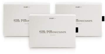 Three FluffCo silk pillowcase boxes arranged together
